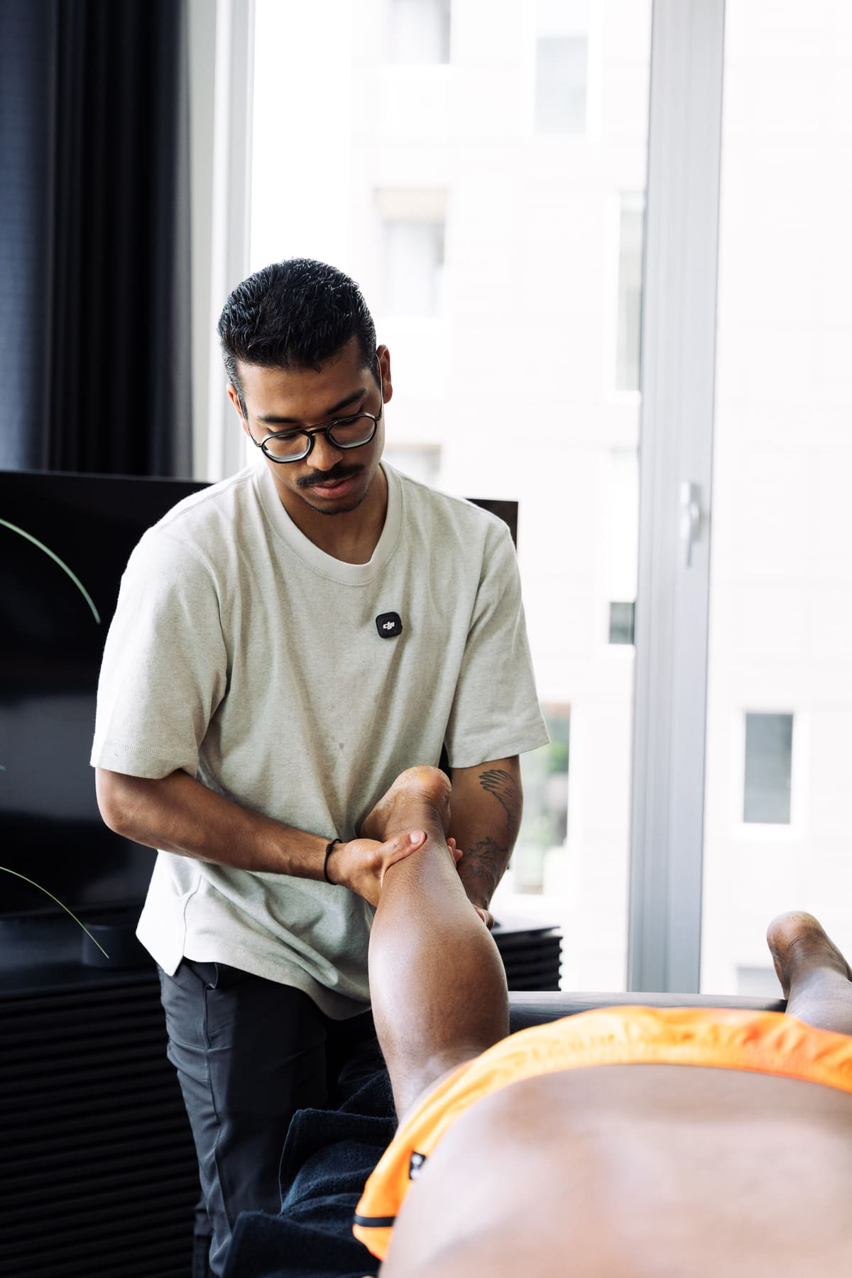 Sebastian Perez performing a deep tissue leg massage
